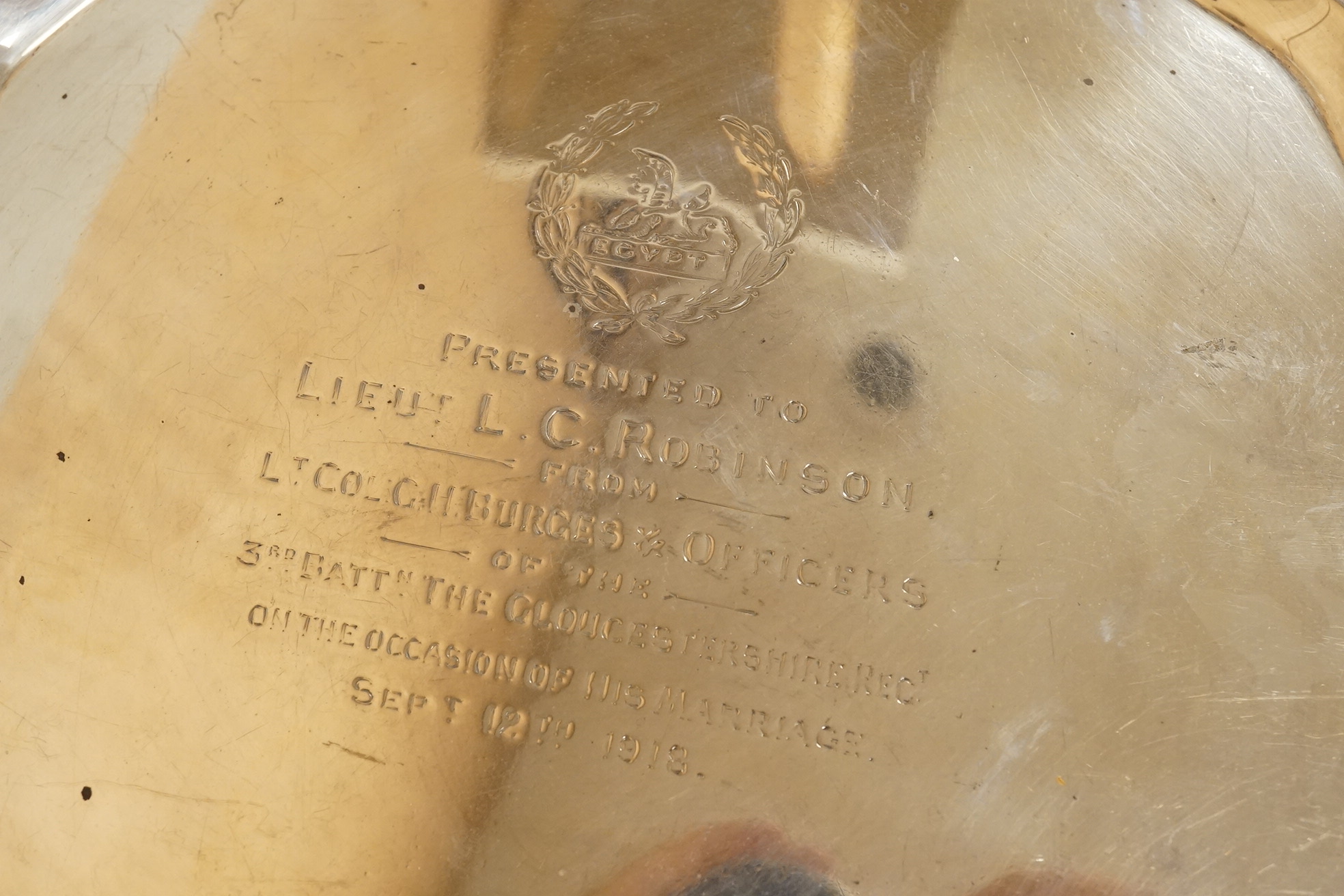 A George V silver salver, by Albert Faulkner, Sheffield, 1917, with engraved military related inscription, on three scroll feet, 25.9cm, 20.6oz.